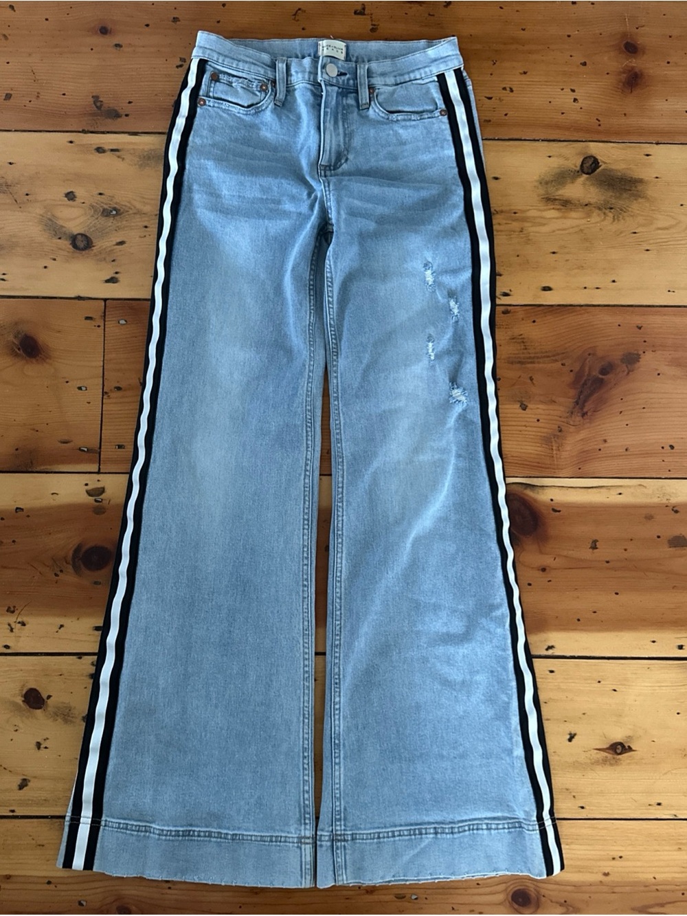 Alice + Olivia size 27 Light Blue Flared Jeans with Black & White Side Stripes